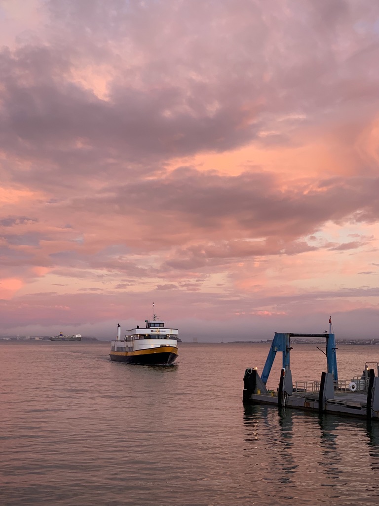 Ferry sunset over the water