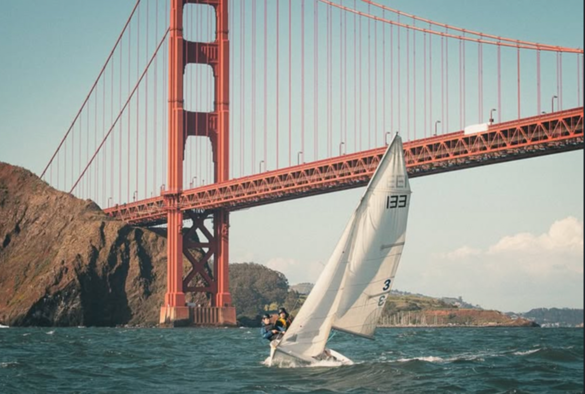 FJ sailboat sailing near the Golden Gate Bridge